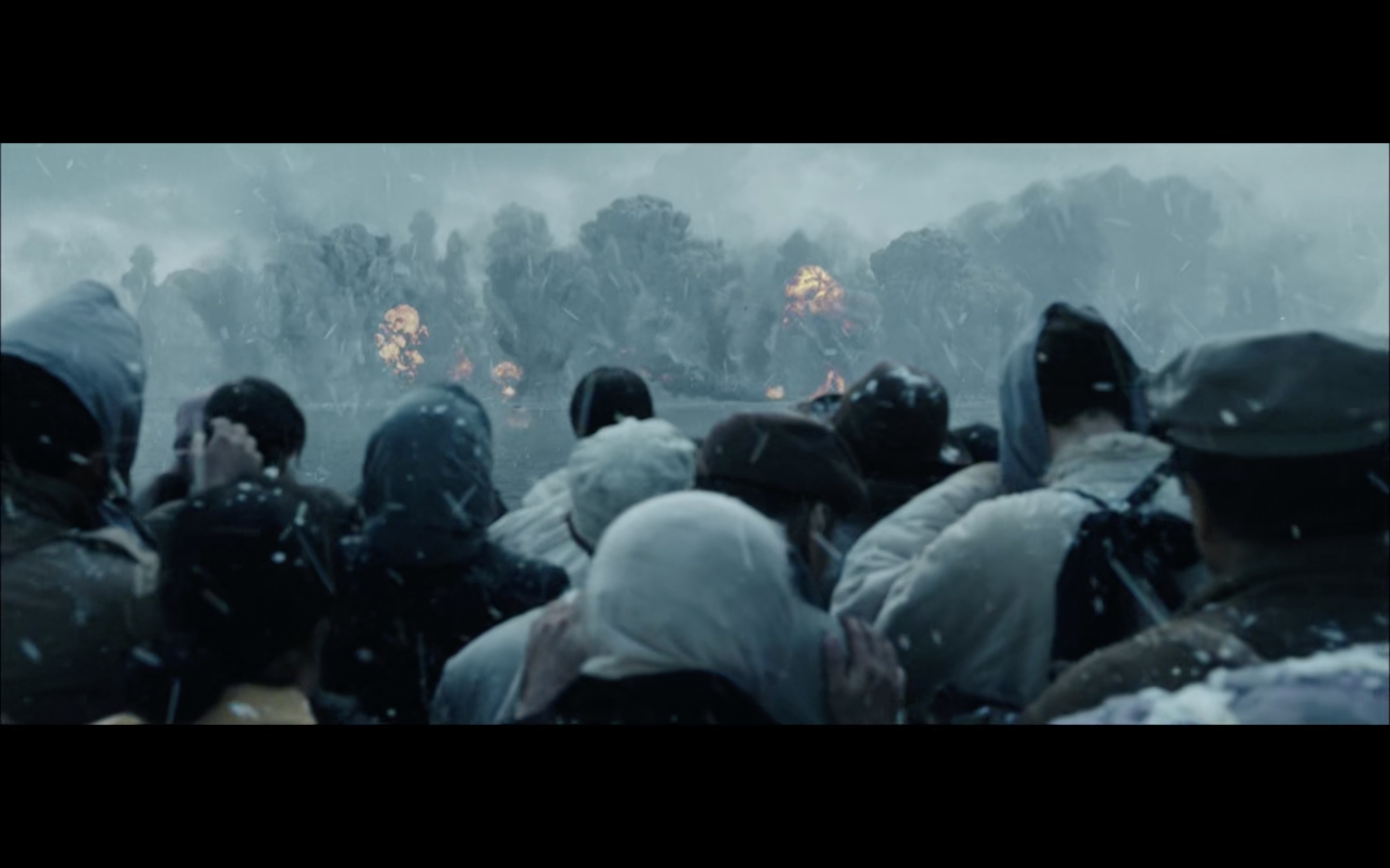 workers with fire in the distance