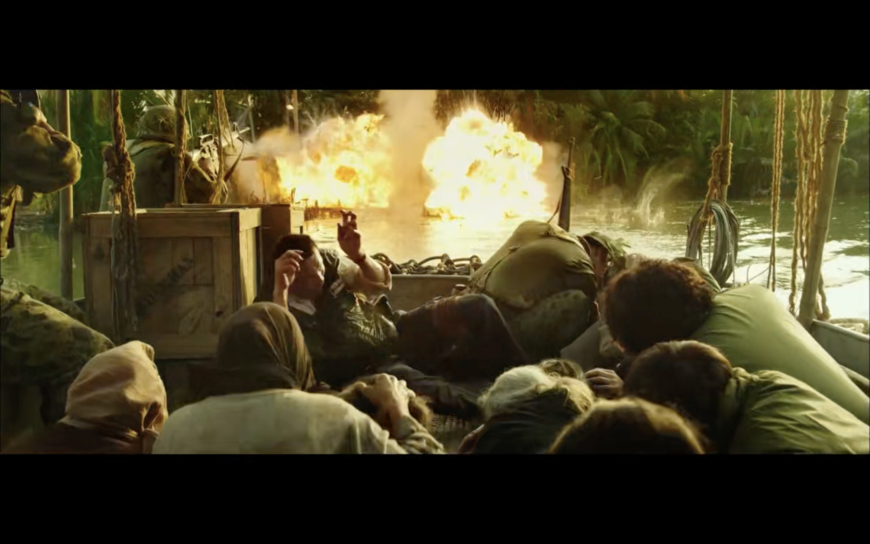 villagers with fire in the background