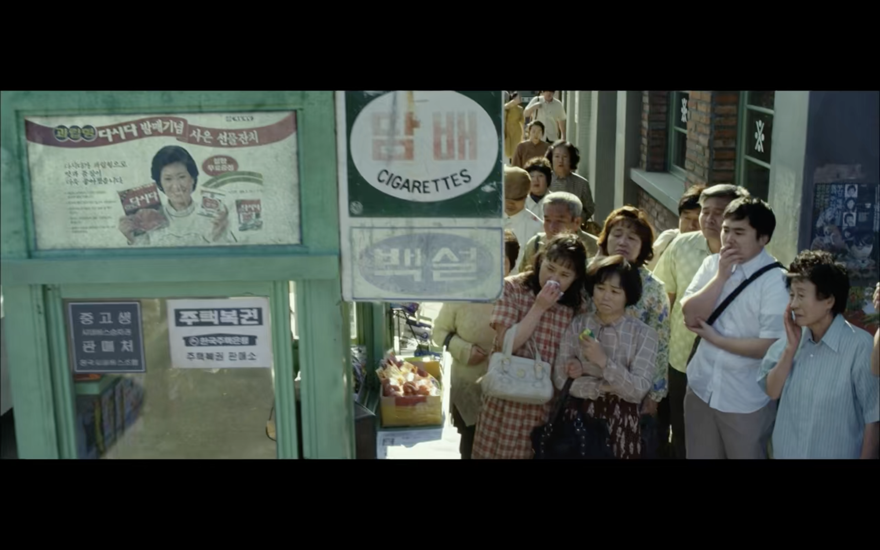 group of people next to bus station