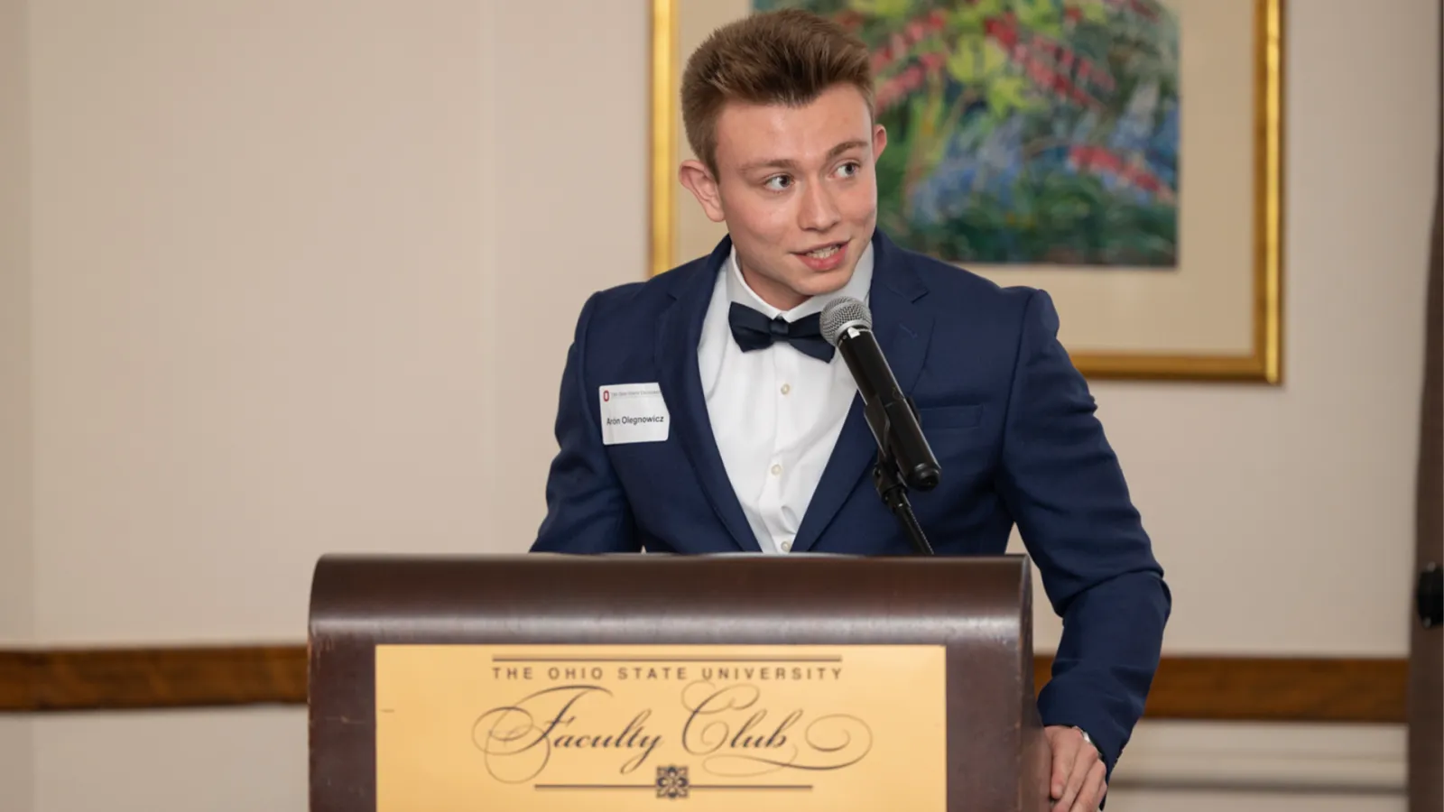Young man standing at podium