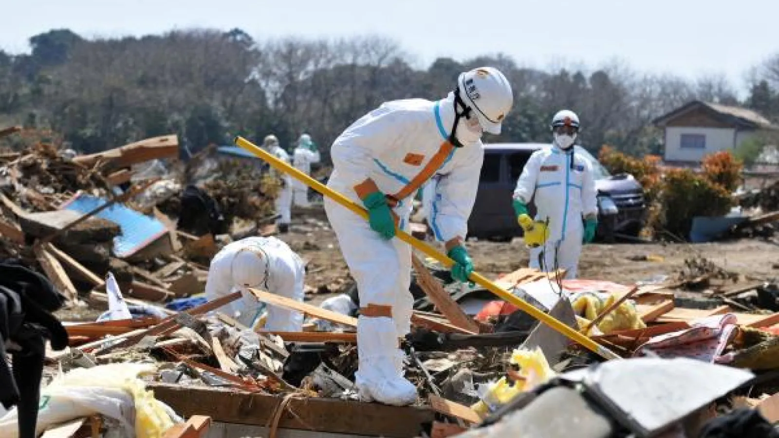Workers Clean Up Area Damaged by March 11 Tsunami 