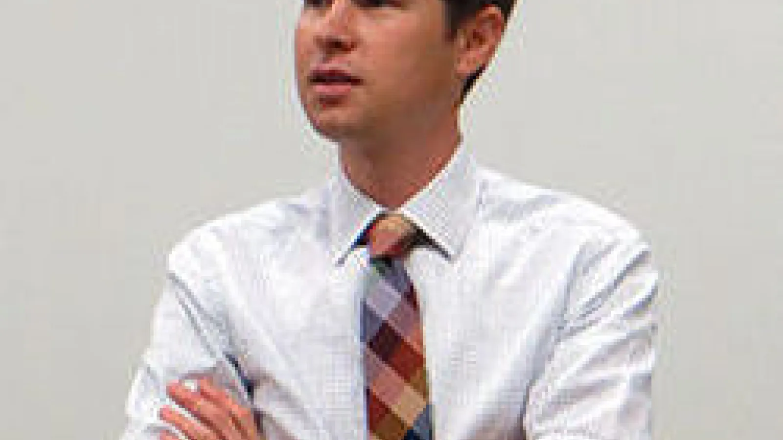 photo of Prof. Joshua Hill a young man with short brown hair