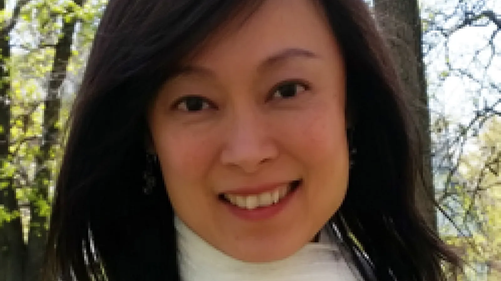 Meow Hui Goh - photoof middle aged woman with long black hair and white scarf