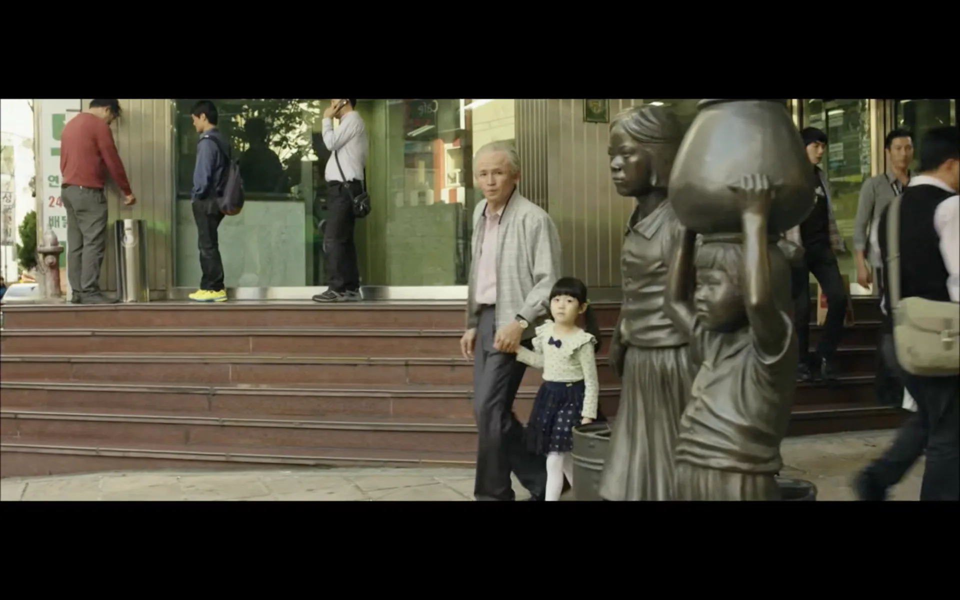 older man and young child on a staircase