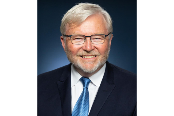 An older man with glasses and gray hair wearing a suit