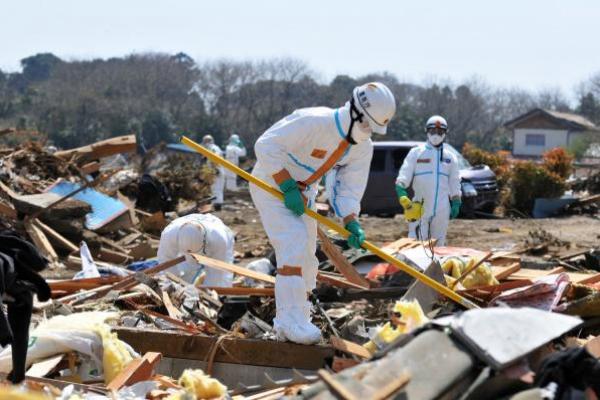 Workers Clean Up Area Damaged by March 11 Tsunami 