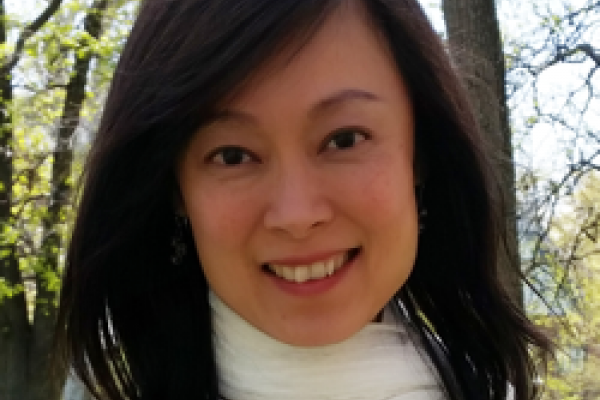 Meow Hui Goh - photoof middle aged woman with long black hair and white scarf