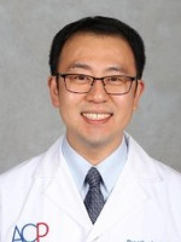Picture of a man with short black hair