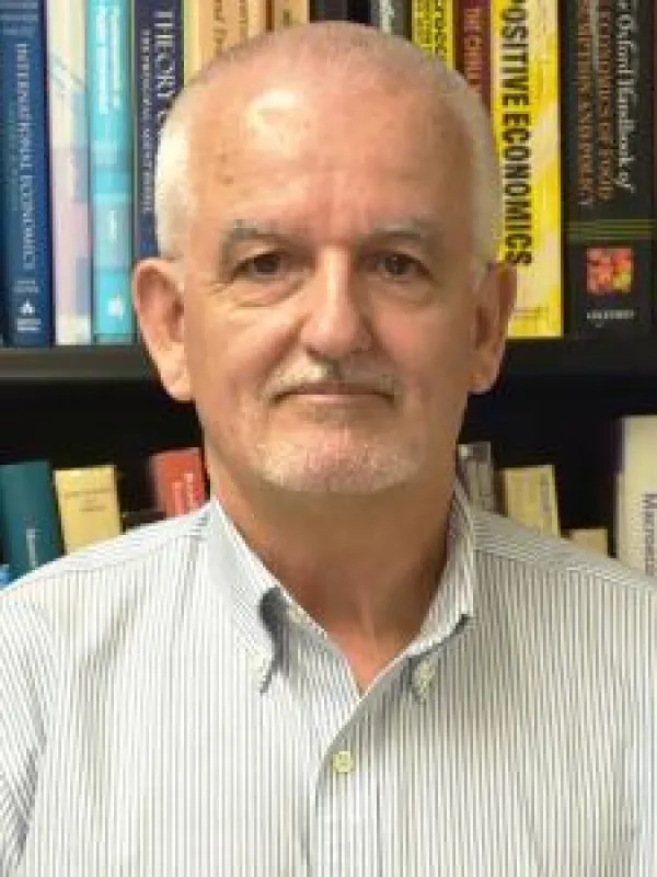 Picture of an older man with short white hair and glasses