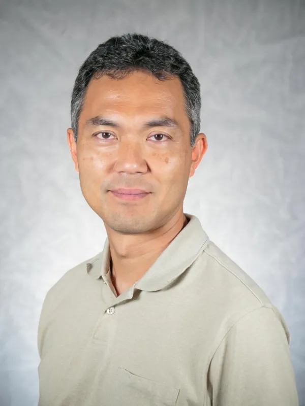 Picture of a man with short black hair