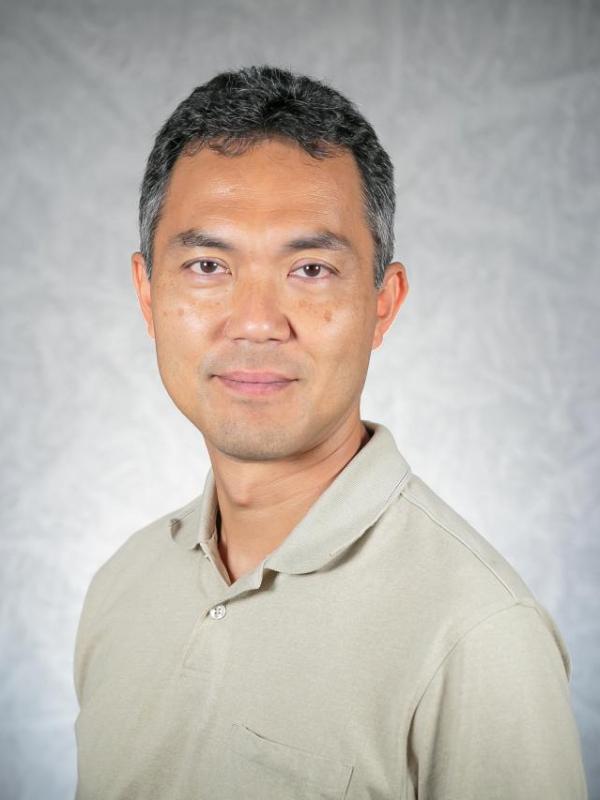 Picture of a man with short black hair