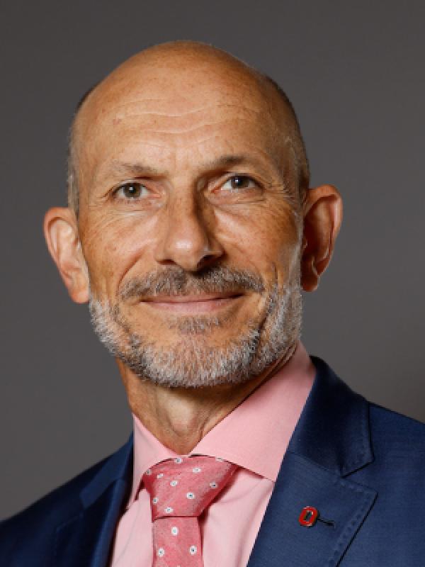 a middle aged man wearing a suit