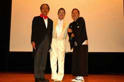 Traditional Japanese Performance Show! Three people standing on stage.